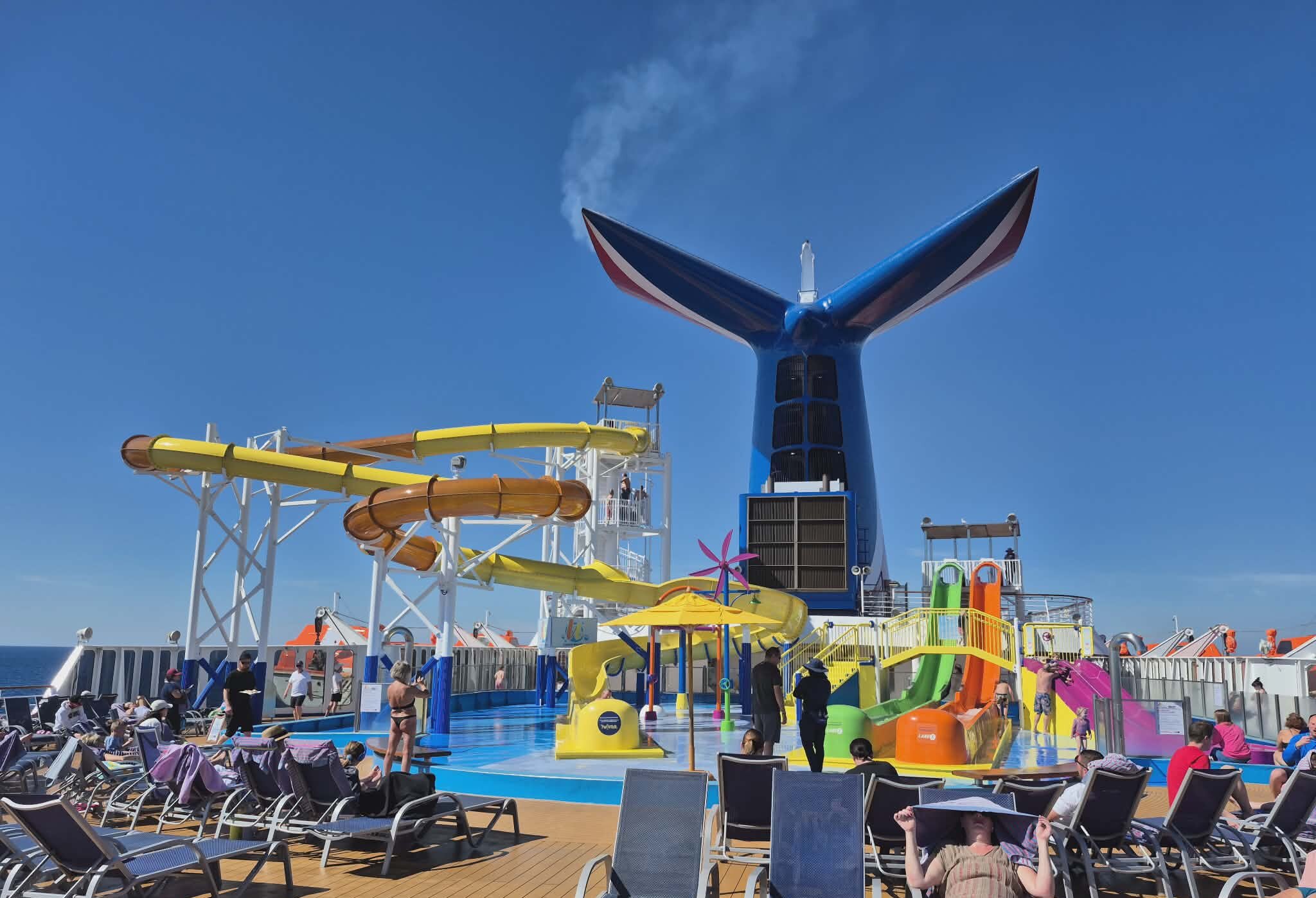 Carnival Celebration full broadside profile with pilot boat alongside
